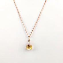 Load image into Gallery viewer, Le Pendentif Goutte Éternelle de la fine joaillerie MONA est un superbe collier en or rose, mettant en valeur un seul pendentif en pierre précieuse jaune en forme de poire, magnifiquement conçu en or 10 carats, élégamment serti sur un fond blanc.